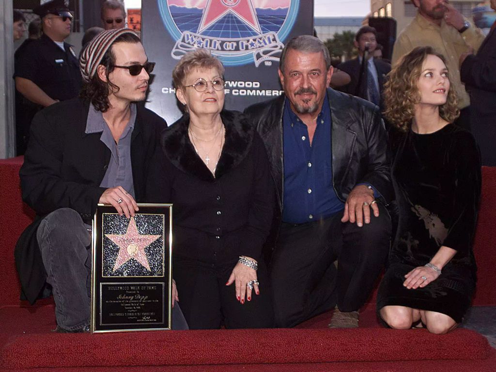 Johnny with his parents and Vanessa