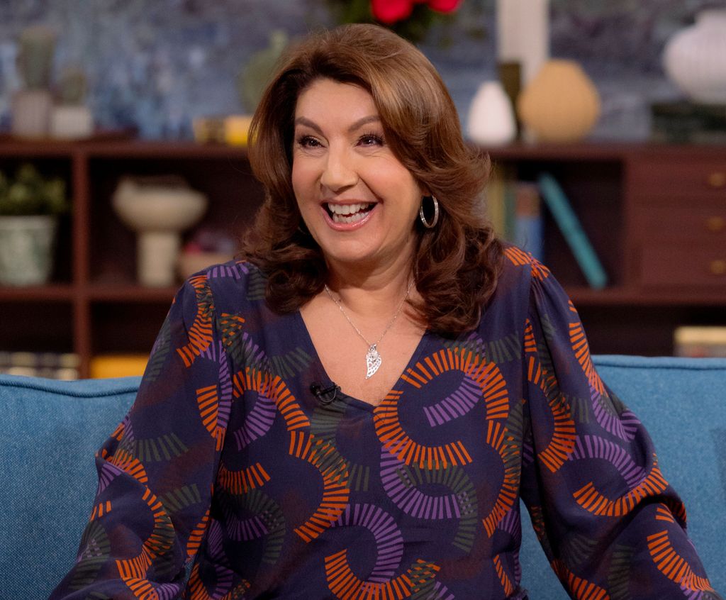 Jane McDonald in a purple outfit