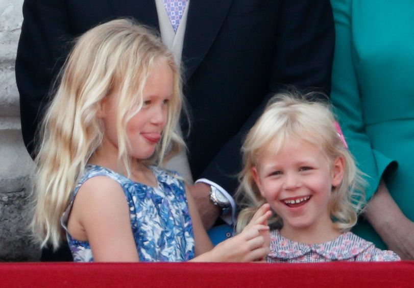 Savannah Phillips and Isla Phillips watch the flypast from the balcony of Buckingham Palace 