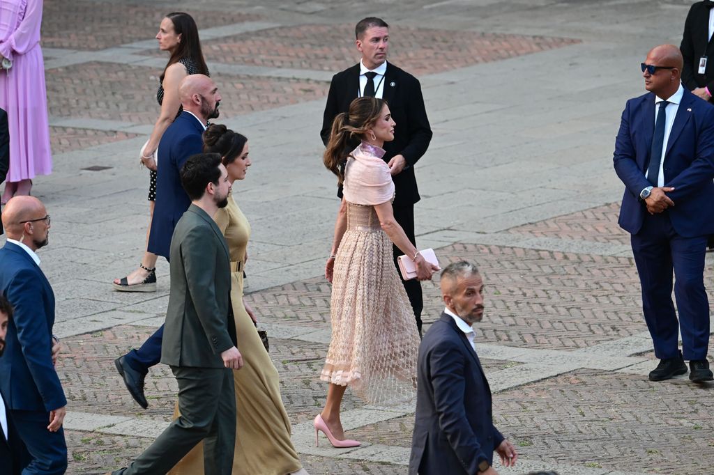 Queen Rania followed by her son and daughter-in-law