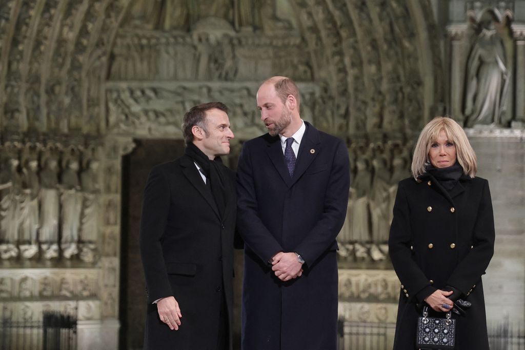 French President Emmanuel Macron (L) and his wife Brigitte (R) welcome Britain's William, Prince of Wales head of a ceremony to mark the re-opening of the landmark Notre-Dame Cathedral