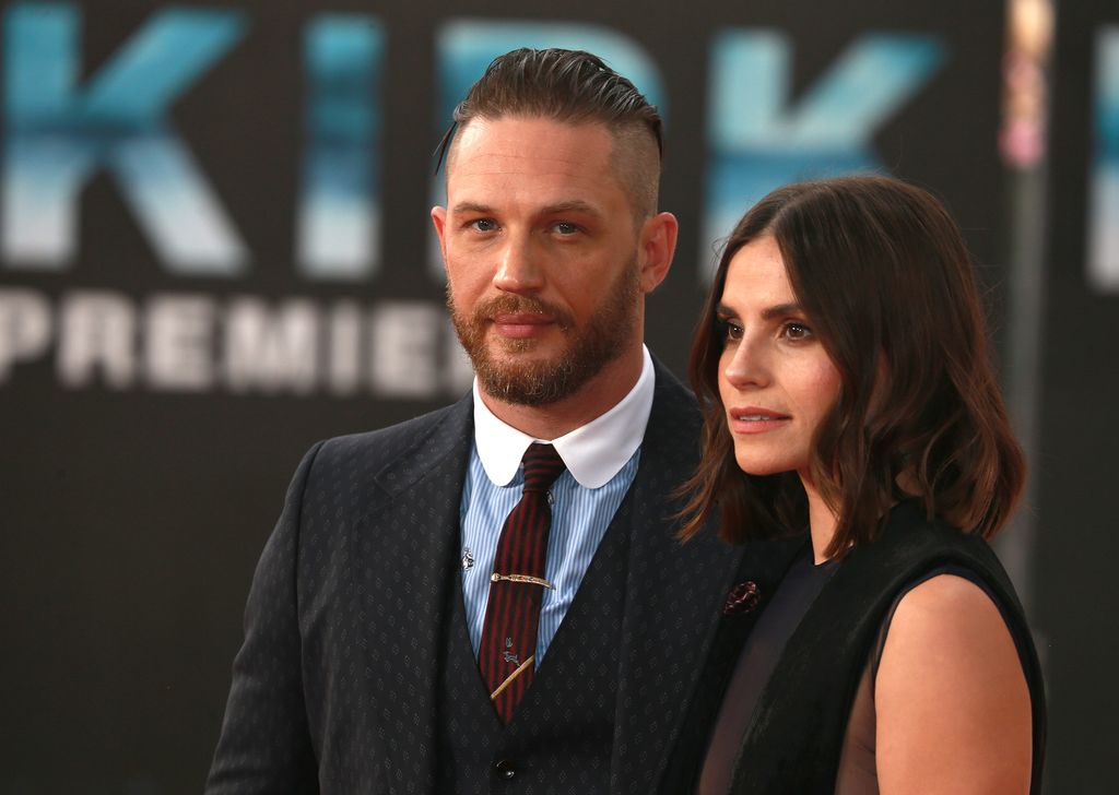 Tom Hardy and Charlotte Riley standing side by side while at the Dunkirk premiere