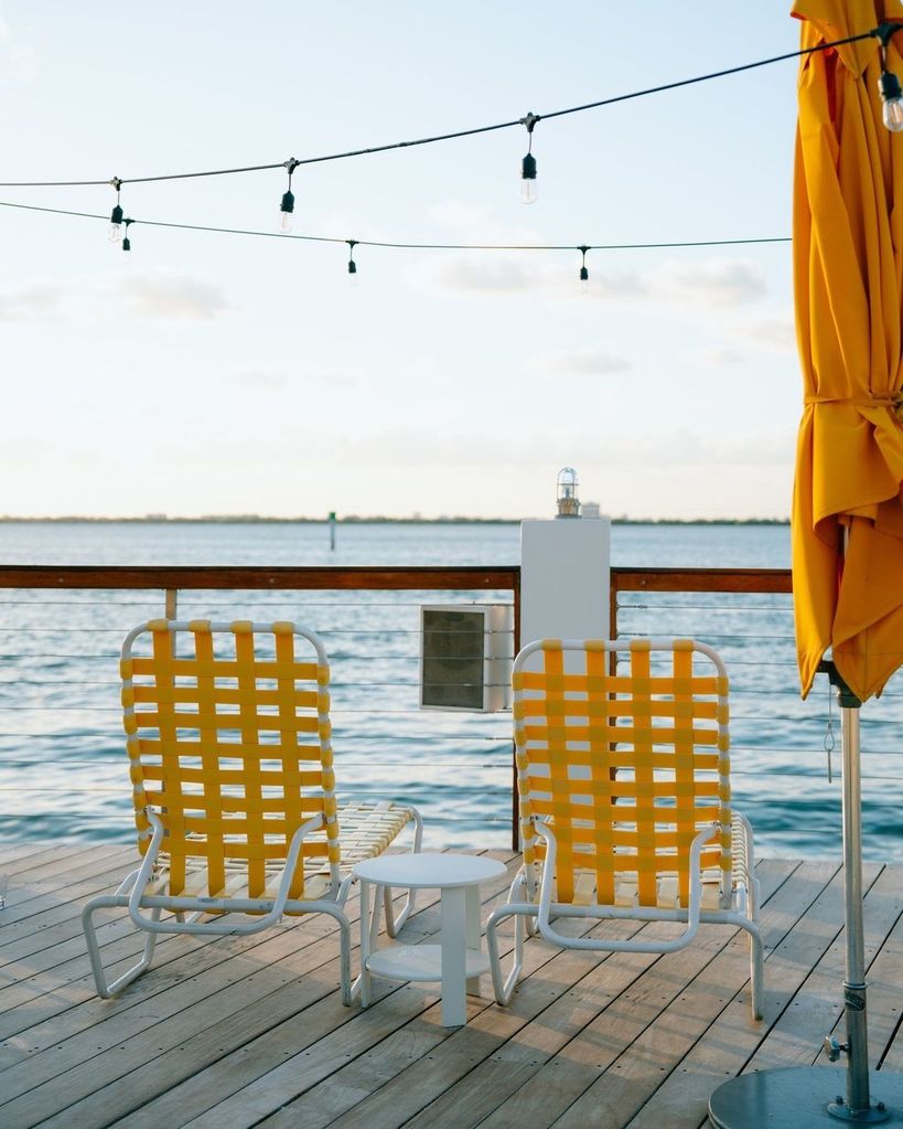 Yellow deckchairs looking out onto the bay