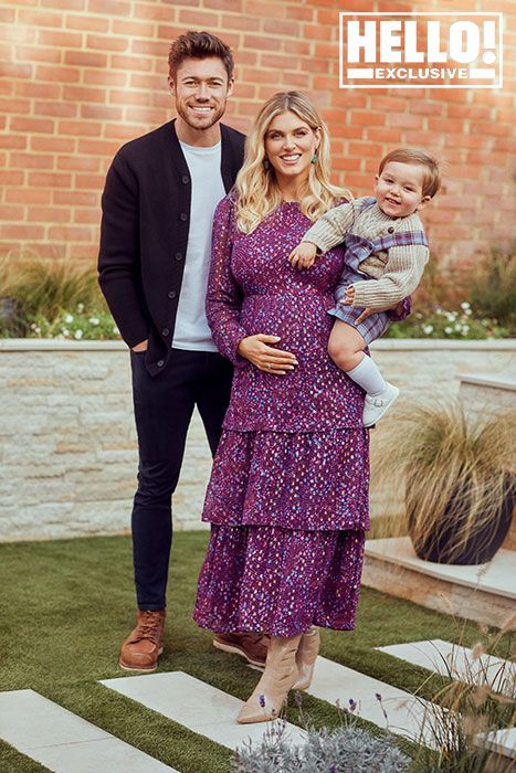Ashley James posing with her partner and her son