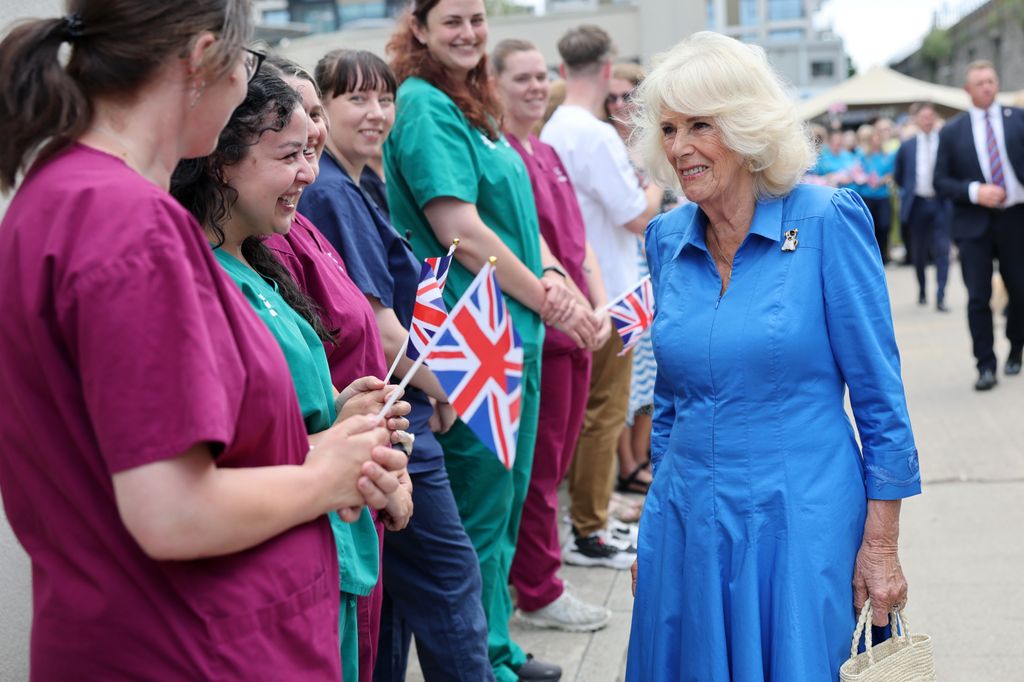 queen camilla during visit to battersea dogs & cats home