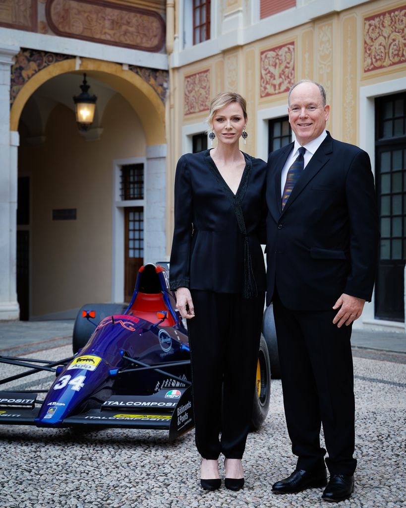 Princess Charlene and Prince Albert posing together at the reception