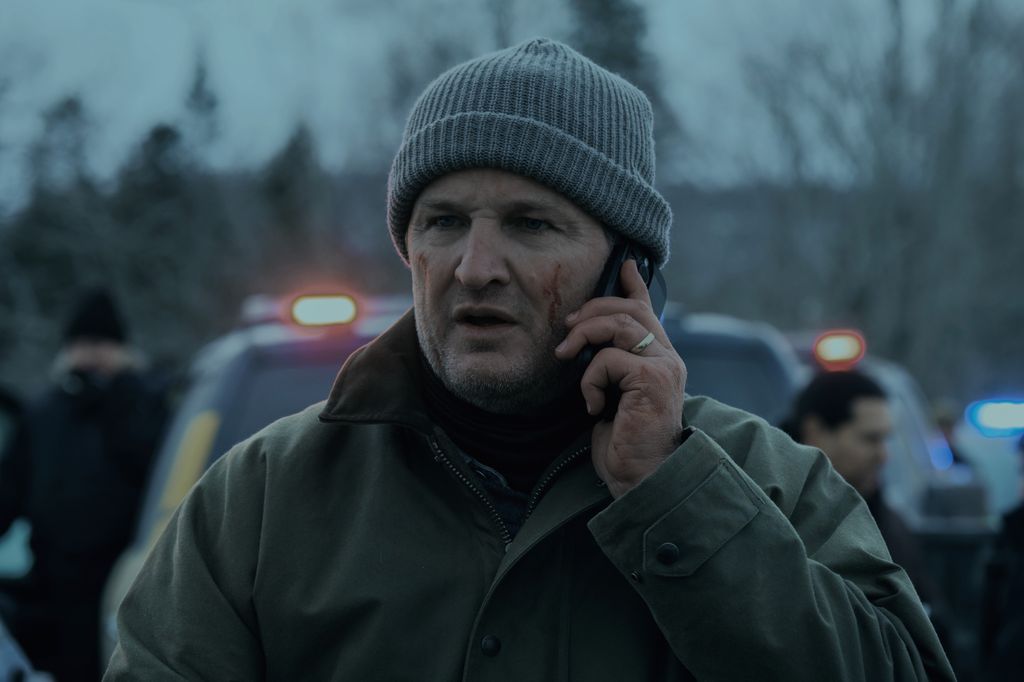 A man in a hat on the phone