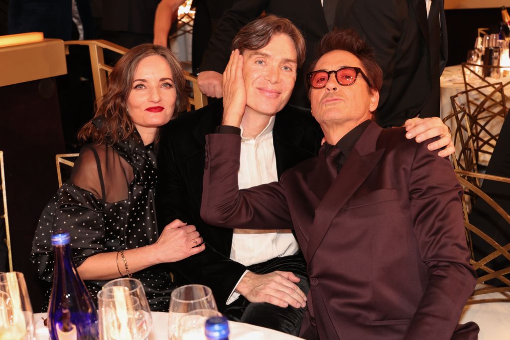 Yvonne McGuinness, Cillian Murphy, and Robert Downey Jr. at the 81st Golden Globe Awards held at the Beverly Hilton Hotel on January 7, 2024 in Beverly Hills, California