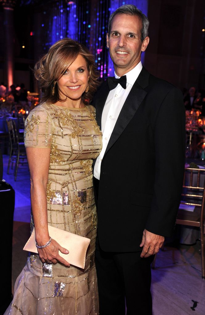 Katie Couric in a gold dress with her husband John Molner 