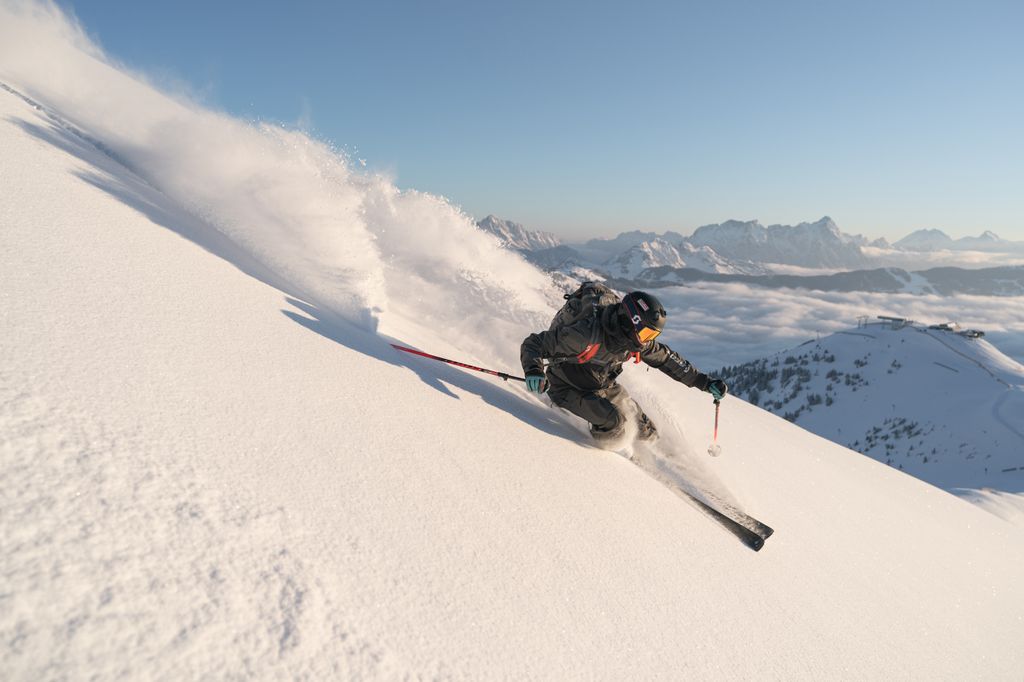 Leogang Austria man skiing down piste 