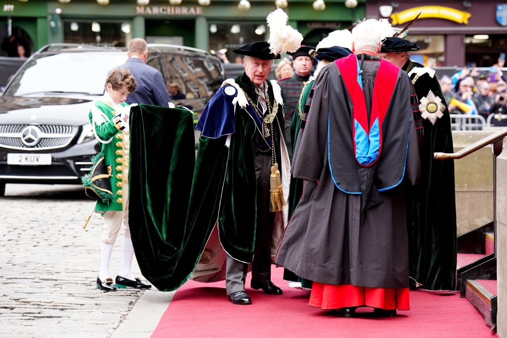 King Charles is greeted by the Dean of St Giles' Cathedral as he arrives for the Order of the Thistle Service at St Giles' Cathedral
