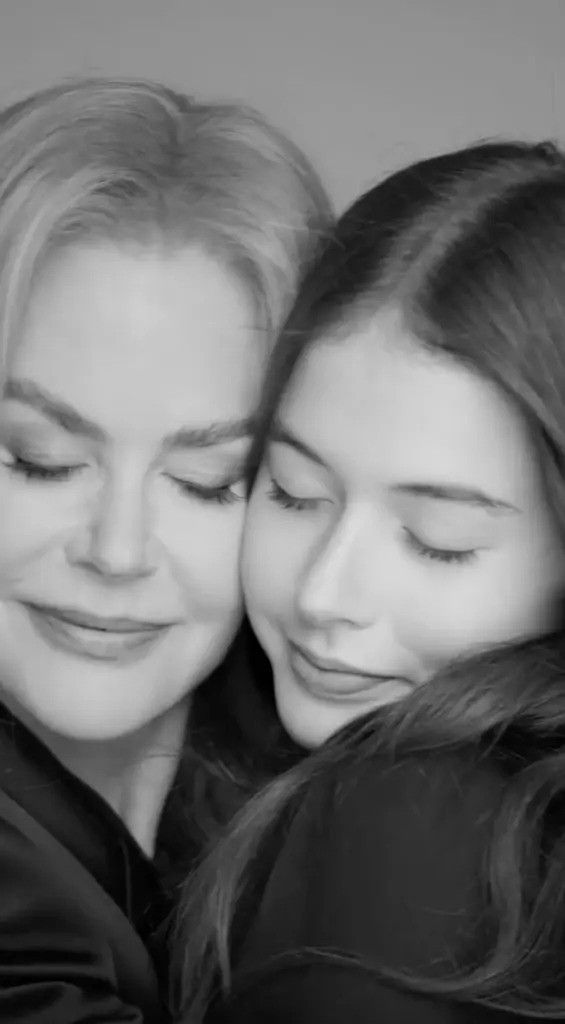 nicole kidman and faith with faces pushed together and eyes closed