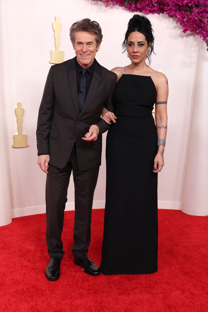 Willem Dafoe and Giada Colagrande attend the 96th Annual Academy Awards