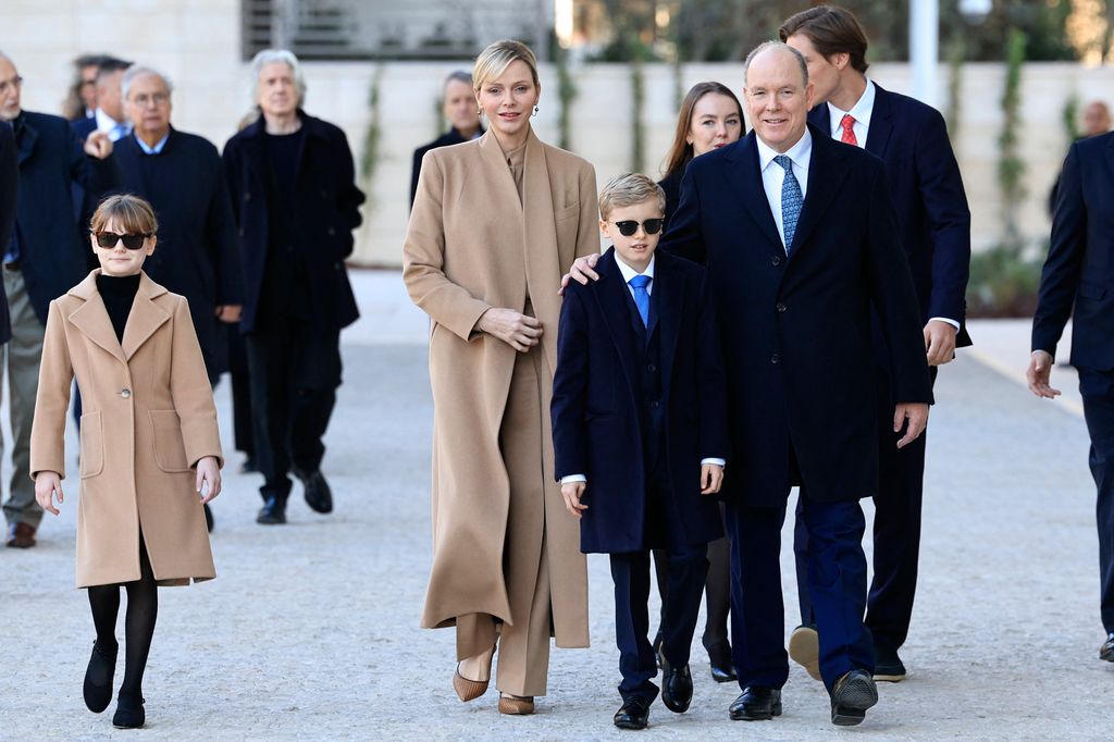 Prince Albert, Princess Charlene, Princess Gabriella and jacques walking 