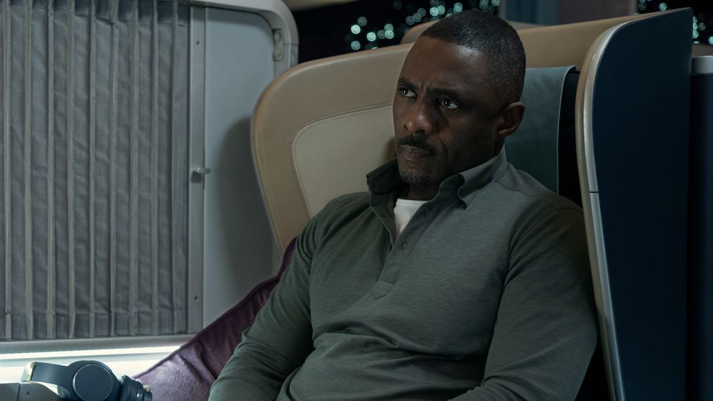 Idris Elba as Sam sits in chair in Apple TV+'s Hijack