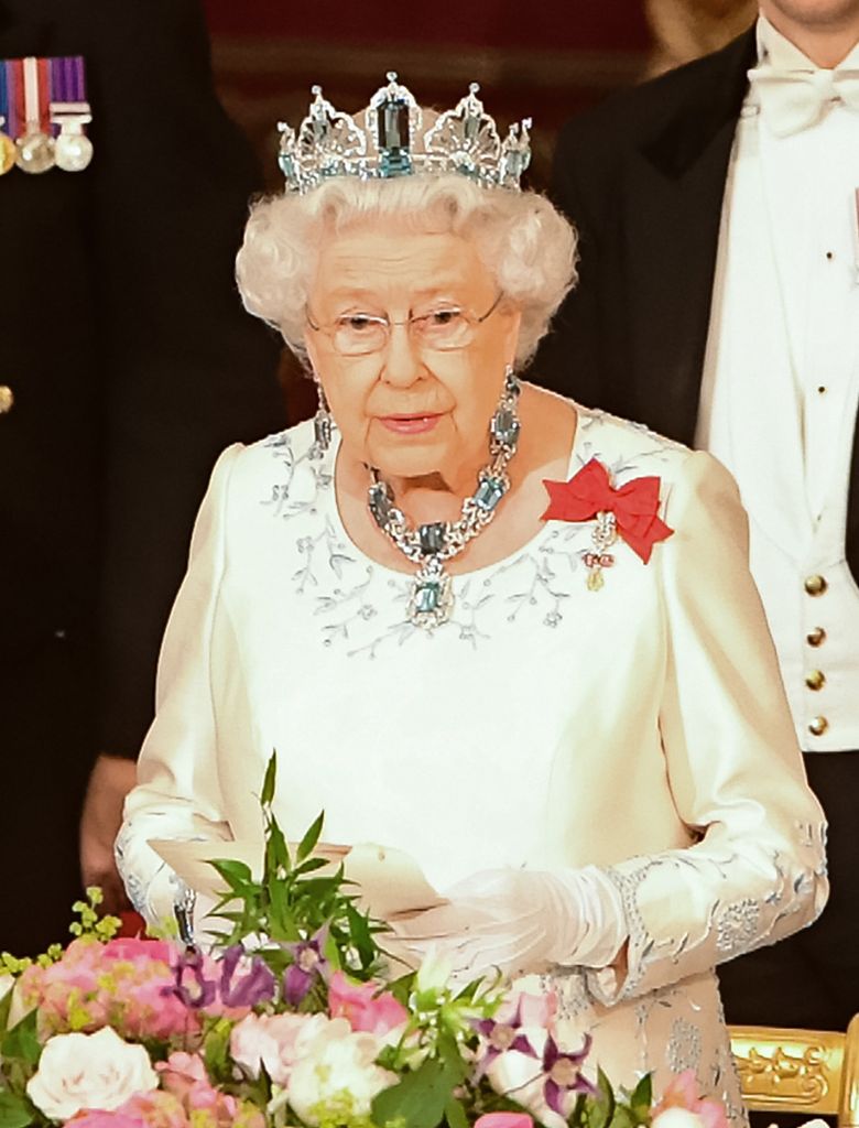 Britain's Queen Elizabeth II (R) makes a speech as Spanish King Felipe VI looks on during a State Banquet at Buckingham Palace in central London on July 12, 2017