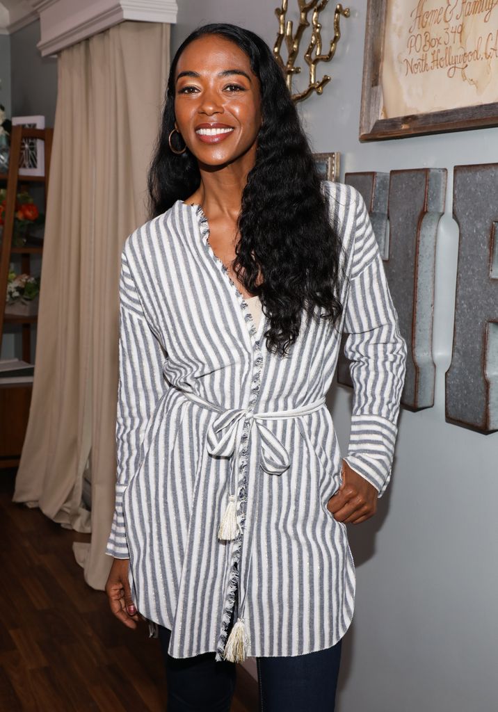 Ananda Lewis in striped shirt