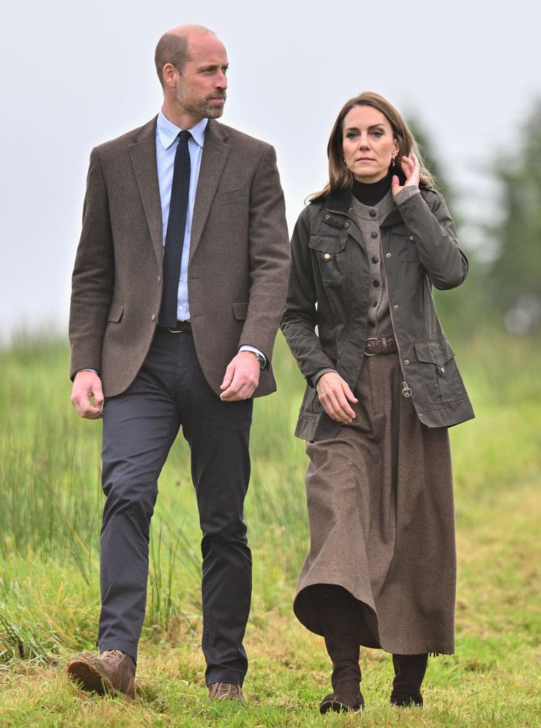 Prince William and Kate Middleton with sad expressions