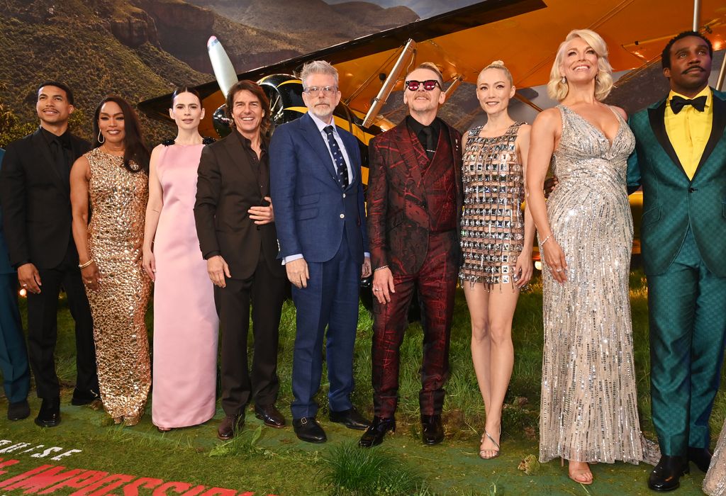 Greg Tarzan Davis, Angela Bassett, Hayley Atwell, Tom Cruise, Christopher McQuarrie, Simon Pegg, Pom Klementieff, Hannah Waddingham and Tramell Tillman pose together at the premiere