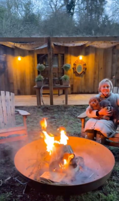 Shirlie Kemp sits by firepit in her garden