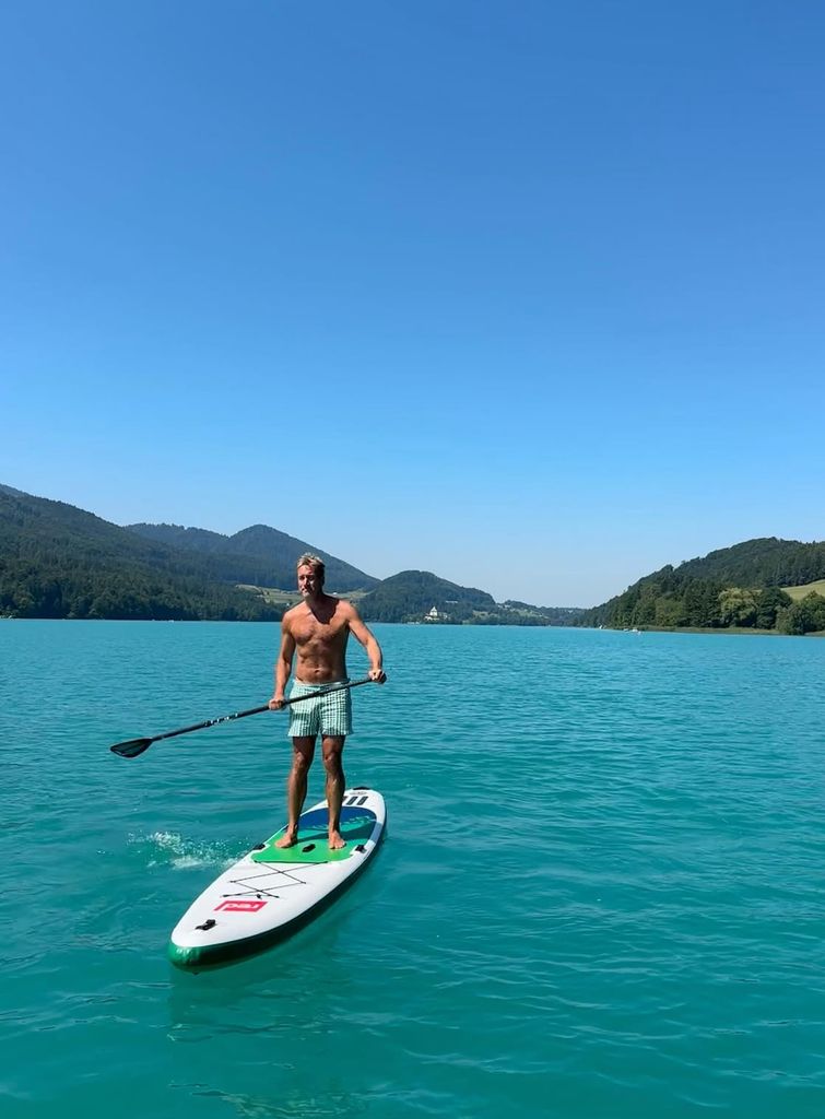 Ben Fogle has shared a snap of himself paddle boarding while on holiday in the Alps