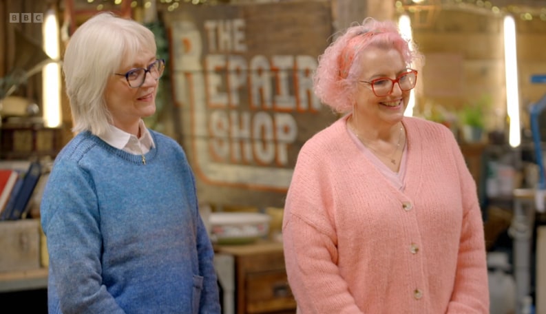 Close up of two ladies wearing jumpers