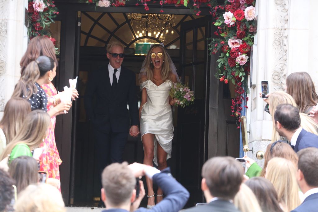 Made In Chelsea star Jamie Laing and his new wife Sophie Habboo emerging from Chelsea Registry Office