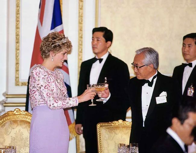 Princess Diana raises a toast during tour of South Korea in 1992