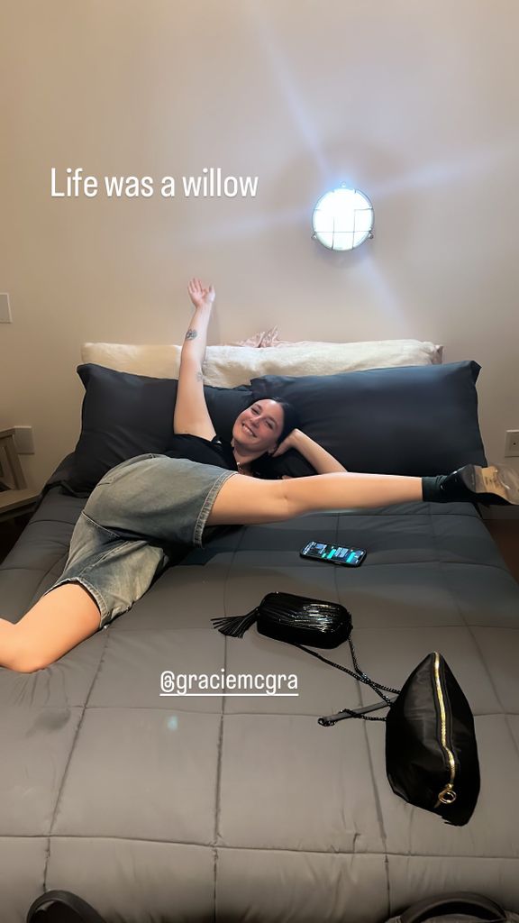 gracie mcgraw lying on a bed