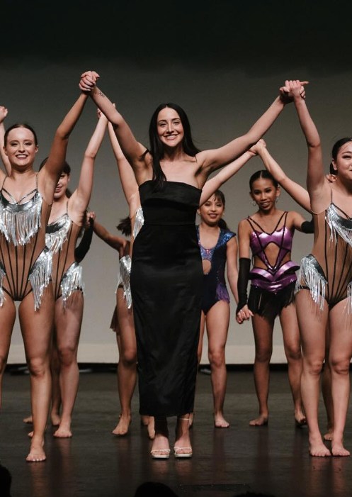 molly long on stage with dancers