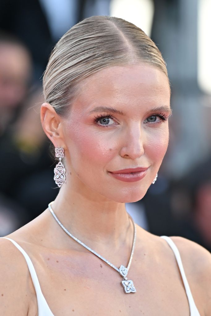 Leonie Hanne was bridal beauty goals at Cannes Film Festival with dazzling silver jewels, pinky blush and middle part bun