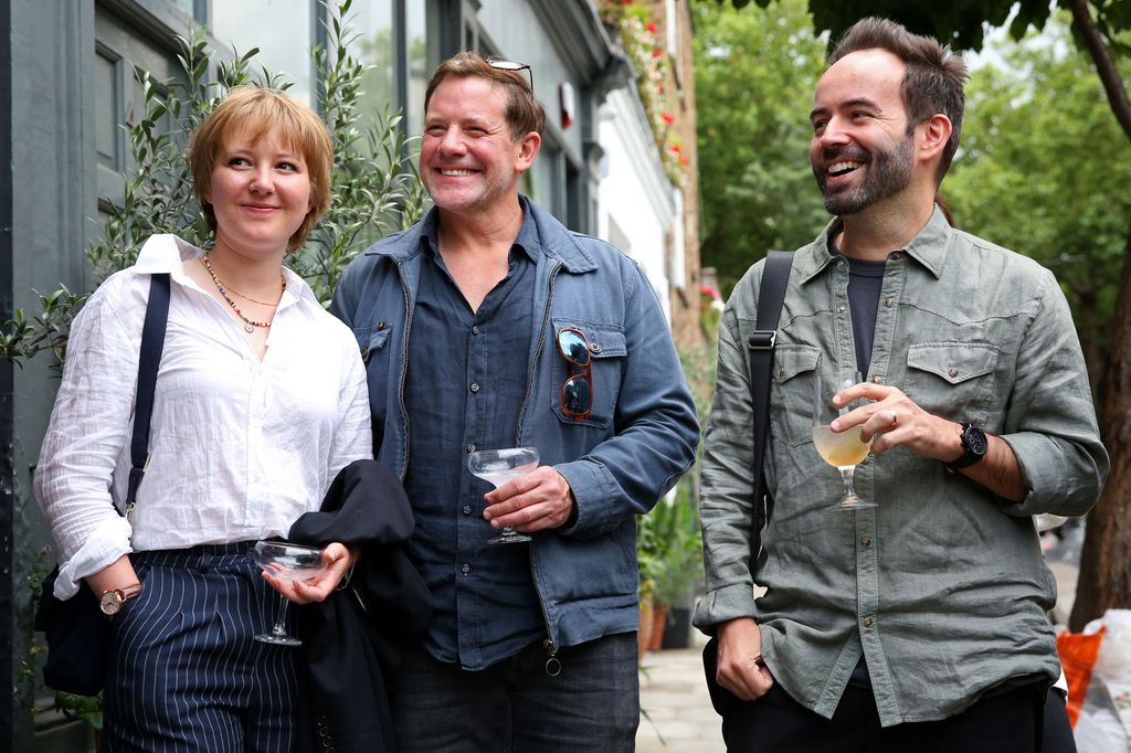 Matt Tebbutt and his daughter standing with a man