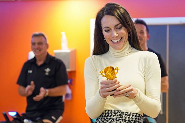 kate middleton on a spin bike with a tiny trophy