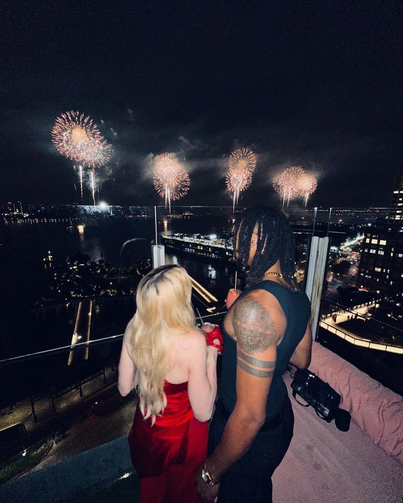 Madonna watches on the fireworks one year after her hospitalisation 