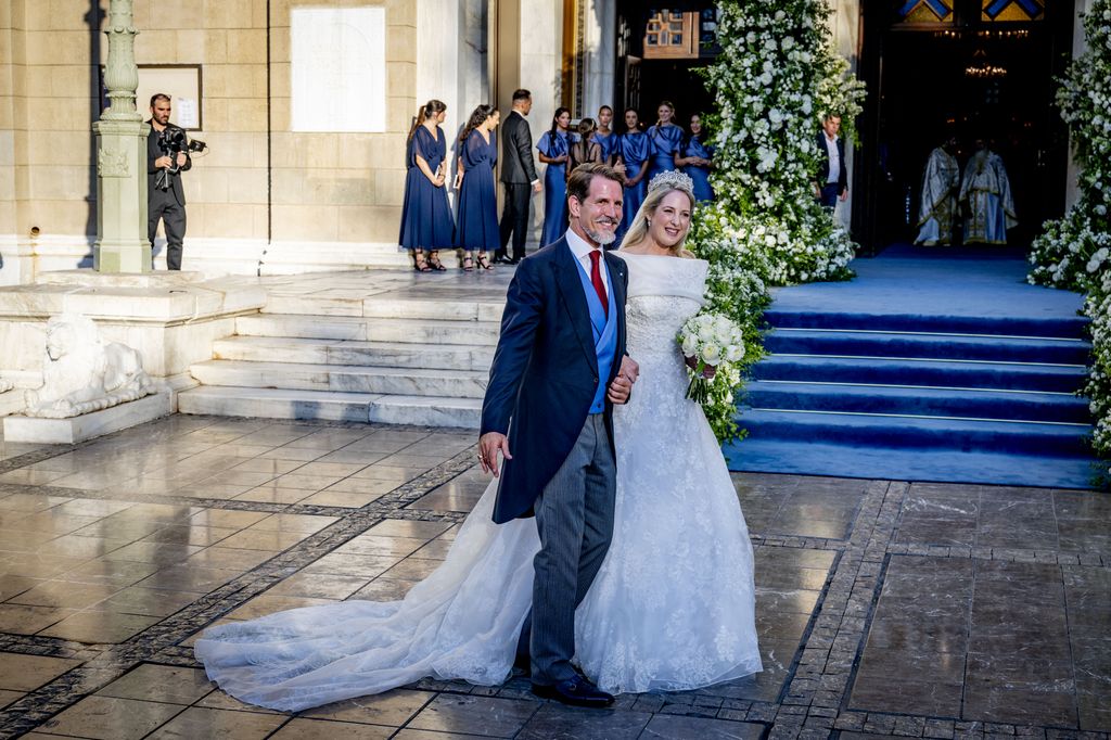 Princess Theodora in wedding dress beside Crown Prince Pavlos