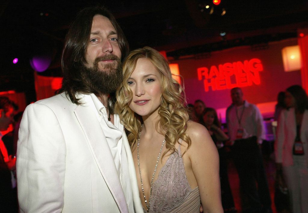 Kate Hudson and husband, musician Chris Robinson, pose as they attend the film premiere after party for the romantic comedy Raising Helen in 2004