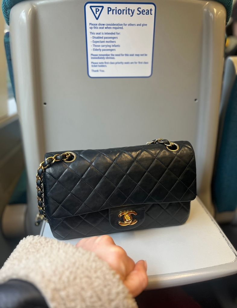 Vintage Chanel bag has a priority seat on train