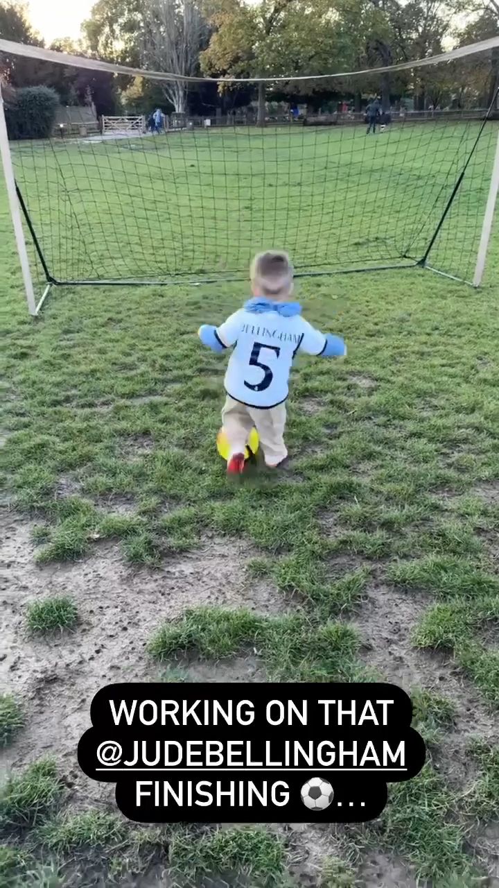 Raphael Redknapp kicking a football into the goal