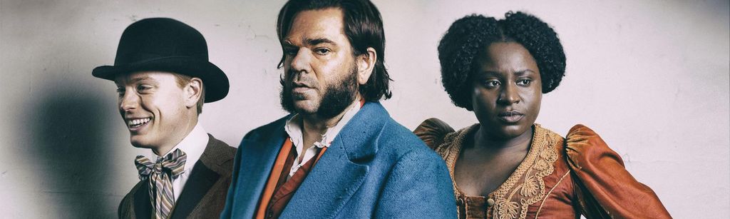 close-up three people dressed in period clothing