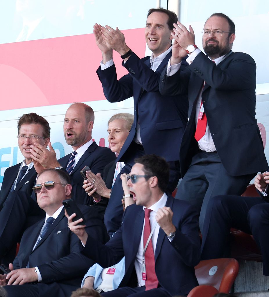 Prince William applauding, others around him are more excited