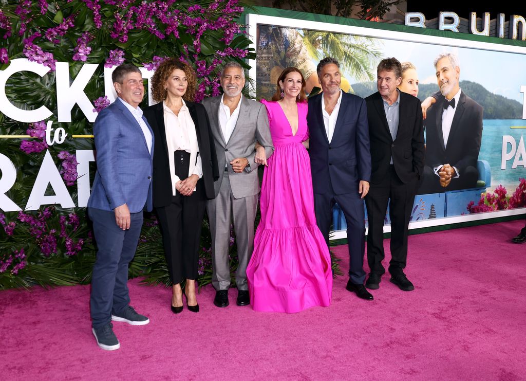 Jeff Shell, CEO, NBCUniversal, Donna Langley, Chairman, Universal Filmed Entertainment Group, George Clooney, Julia Roberts, Ol Parker, Tim Bevan attend the premiere of Universal Pictures' "Ticket To Paradise" at Regency Village Theatre on October 17, 202