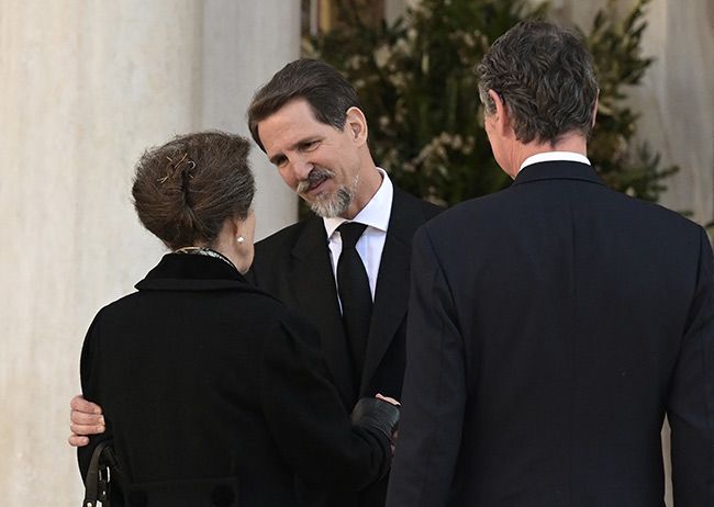 Prince Pavlos of Greece greeting Princess Anne and Sir Timothy Laurence