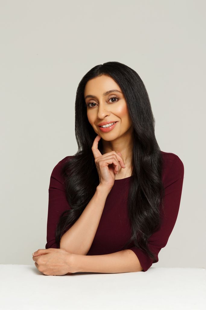 Health and Medical news Woman in a burgundy top with long shiny brown hair 