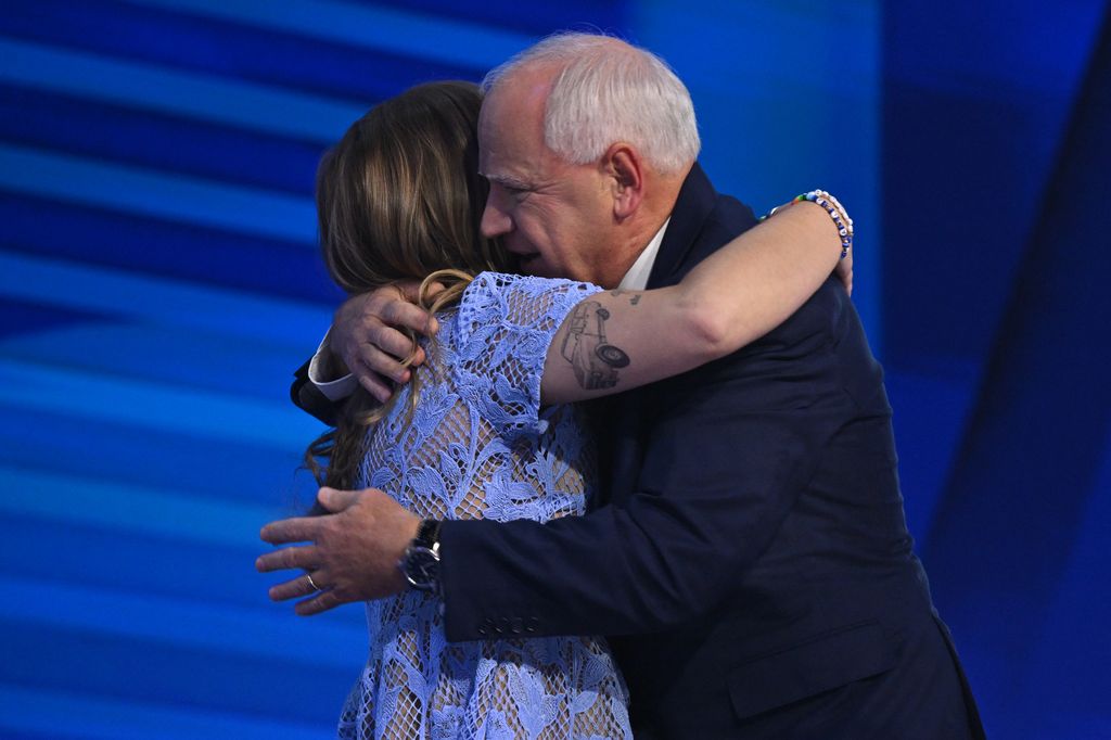 Tim Walz (R) hugs daughter Hope