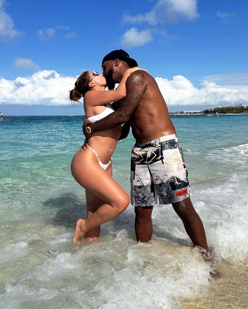Larsa Pippen in white bikini kissing boyfriend Marcus Jordan