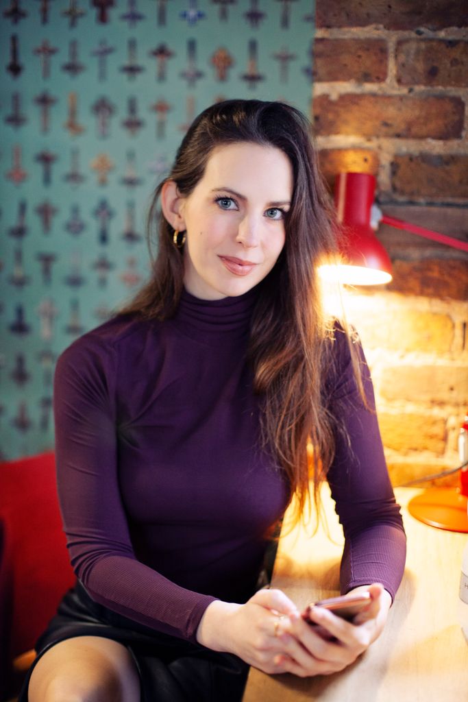 Woman with long hair in polo neck