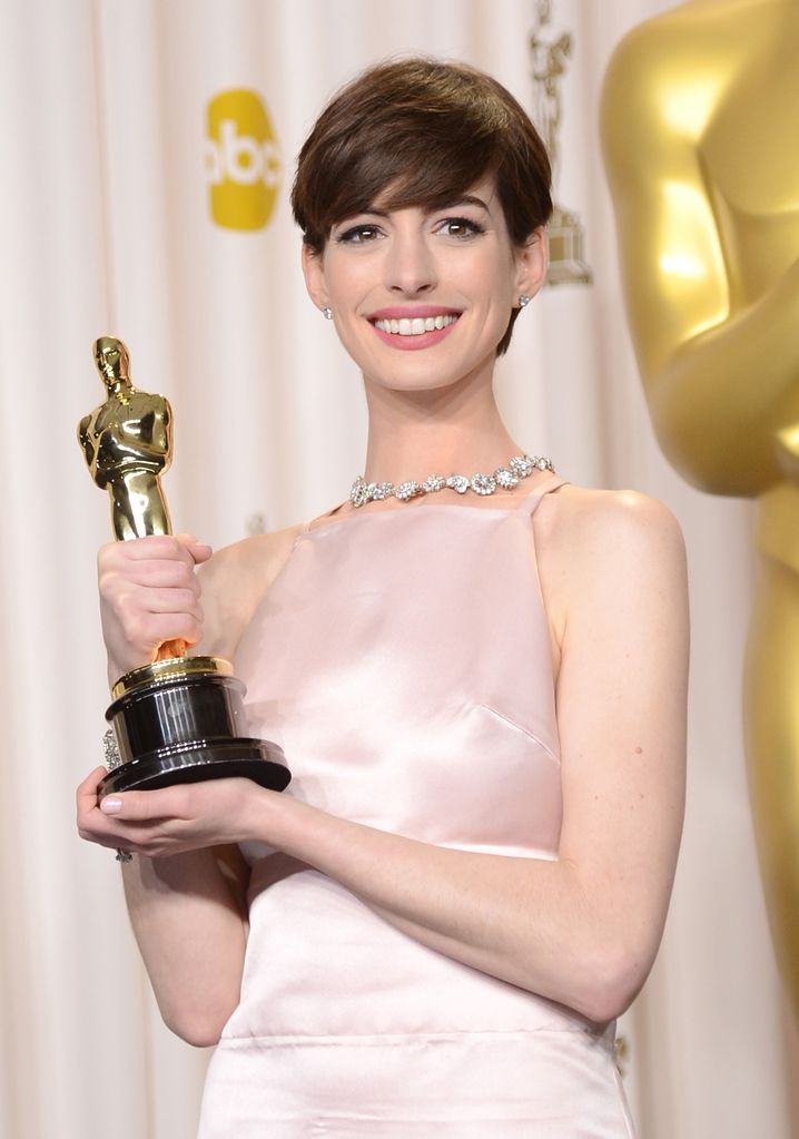 HOLLYWOOD, CA - FEBRUARY 24:  Actress Anne Hathaway, winner of the Best Supporting Actress award for "Les Miserables," poses in the press room during the Oscars held at Loews Hollywood Hotel on February 24, 2013 in Hollywood, California.  (Photo by Jason Merritt/Getty Images)