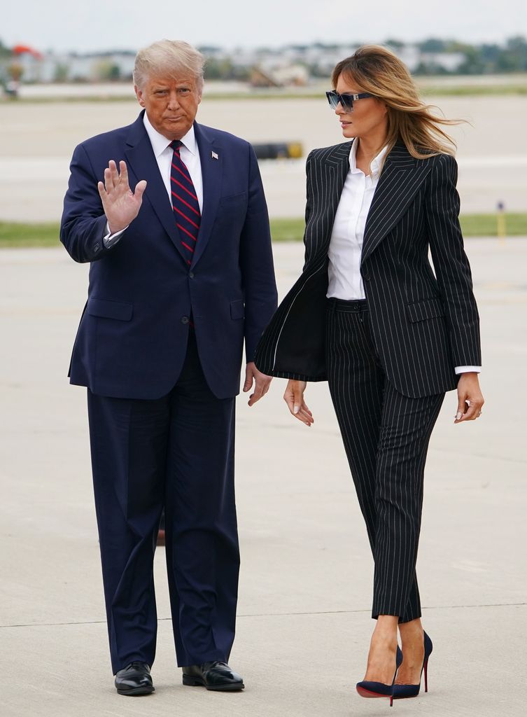 US President Donald Trump and First Lady Melania Trump step off Air Force One upon arrival at Cleveland Hopkins International Airport in Cleveland, Ohio on September 29, 2020. - President Trump is in Cleveland, Ohio for the first of three presidential debates. 