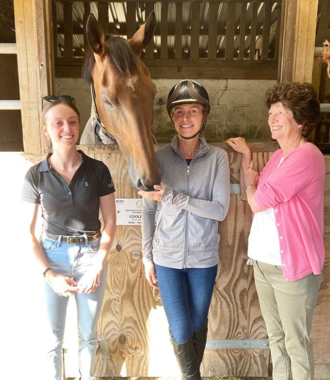 Georgie Campbell and two women with a horse behind them