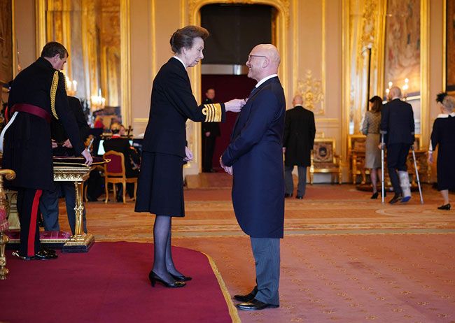 Princess Anne presents Gregg Wallace with MBE